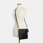 1746671406 coach crossgrain leather kitt messenger bag.jpg
