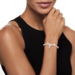 1747013102 ross simons 0.15 ct. t.w. diamond bow bangle bracelet in sterling silver. 7 inches.jpg