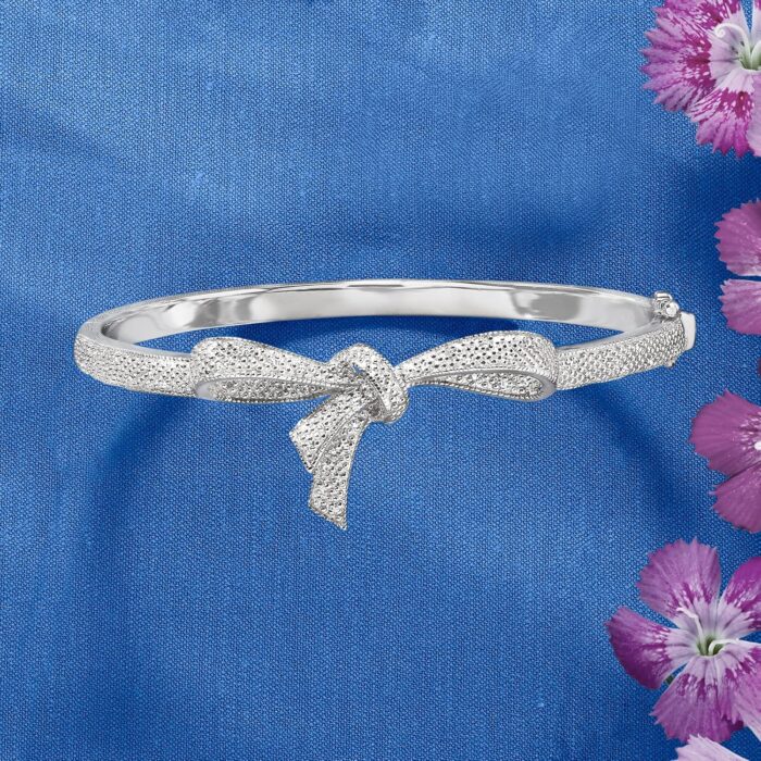 1747013108 ross simons 0.15 ct. t.w. diamond bow bangle bracelet in sterling silver. 7 inches.jpg