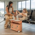 1747127654 stokke jetkids bedbox coral pink ride on suitcase for kids 2 7 years old up to 77 lbs transforms into bed includes mattress decorative stickers adjustable carrying strap.jpg