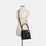 1747213374 coach small town bucket black oxblood.jpg