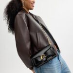 1747259433 coach tabby chain clutch.jpg