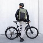 1747316912 thule paramount bike commuter backpack 28l capacity adjustable fit 16 padded laptop sleeve and 11 tablet pocket helmet attachment accessible side phone pocket taillight loop.jpg