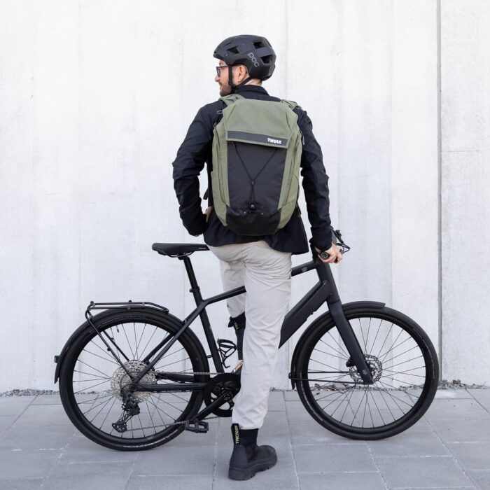 1747316912 thule paramount bike commuter backpack 28l capacity adjustable fit 16 padded laptop sleeve and 11 tablet pocket helmet attachment accessible side phone pocket taillight loop.jpg