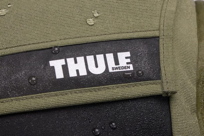 1747316926 thule paramount bike commuter backpack 28l capacity adjustable fit 16 padded laptop sleeve and 11 tablet pocket helmet attachment accessible side phone pocket taillight loop.jpg