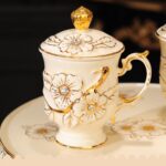 1747324102 high end ceramic tea set with rotatable tray emboss decoration coffee cup set of 6 with teapot.jpg