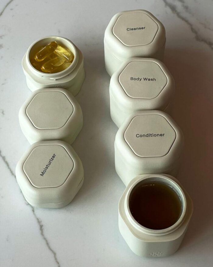 1747342635 cadence travel containers daily routine capsule set magnetic travel capsules for shampoo conditioner body wash pills and more 4 flex mediums 1.32oz 3 flex smalls 0.56oz sand.jpg
