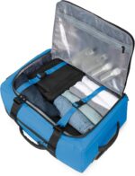 1747605360 travelers choice wheeled duffel blue carry on 21 inch.jpg