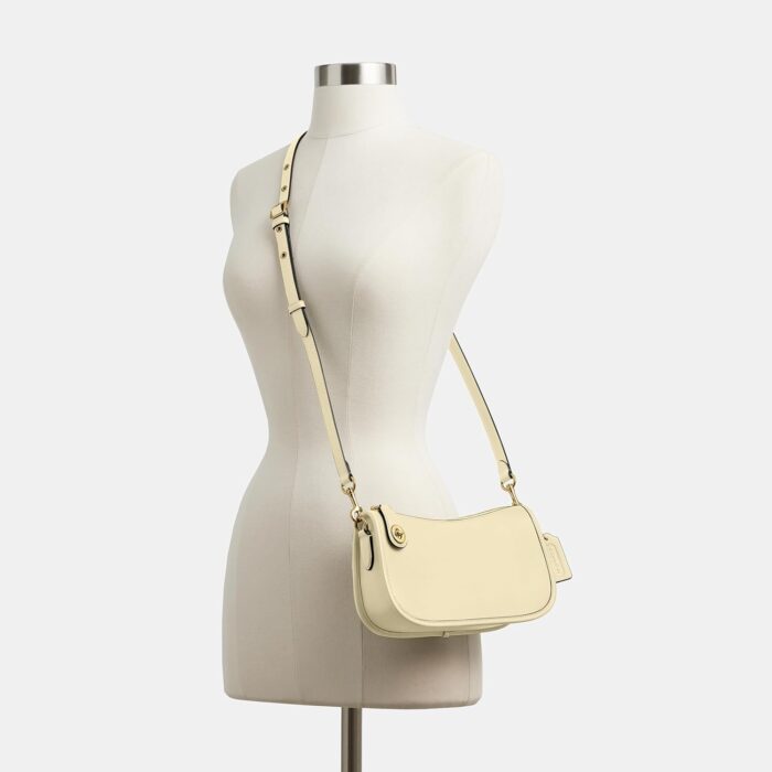 1747680921 coach swinger bag b4moonlight.jpg
