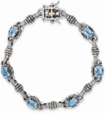 Jewels by lux sterling silver w14k gold swiss blue topaz bracelet.jpg