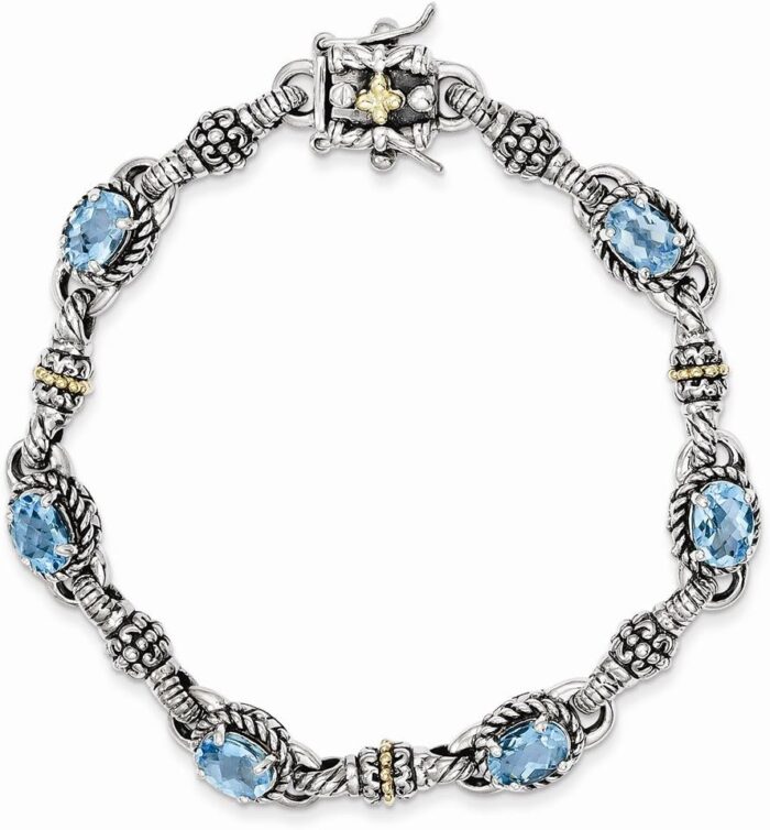Jewels by lux sterling silver w14k gold swiss blue topaz bracelet.jpg