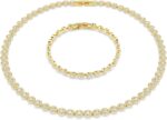 Swarovski una angelic set round cut clear gold tone finish.jpg