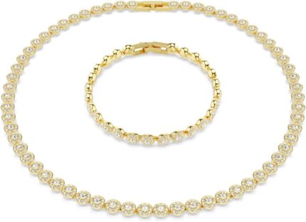 Swarovski una angelic set round cut clear gold tone finish.jpg